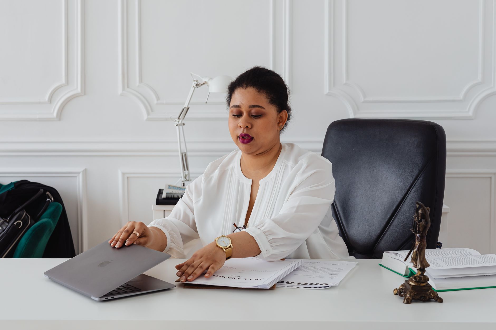 a lawyer reading legal documents on a laptop screen with a document viewer open