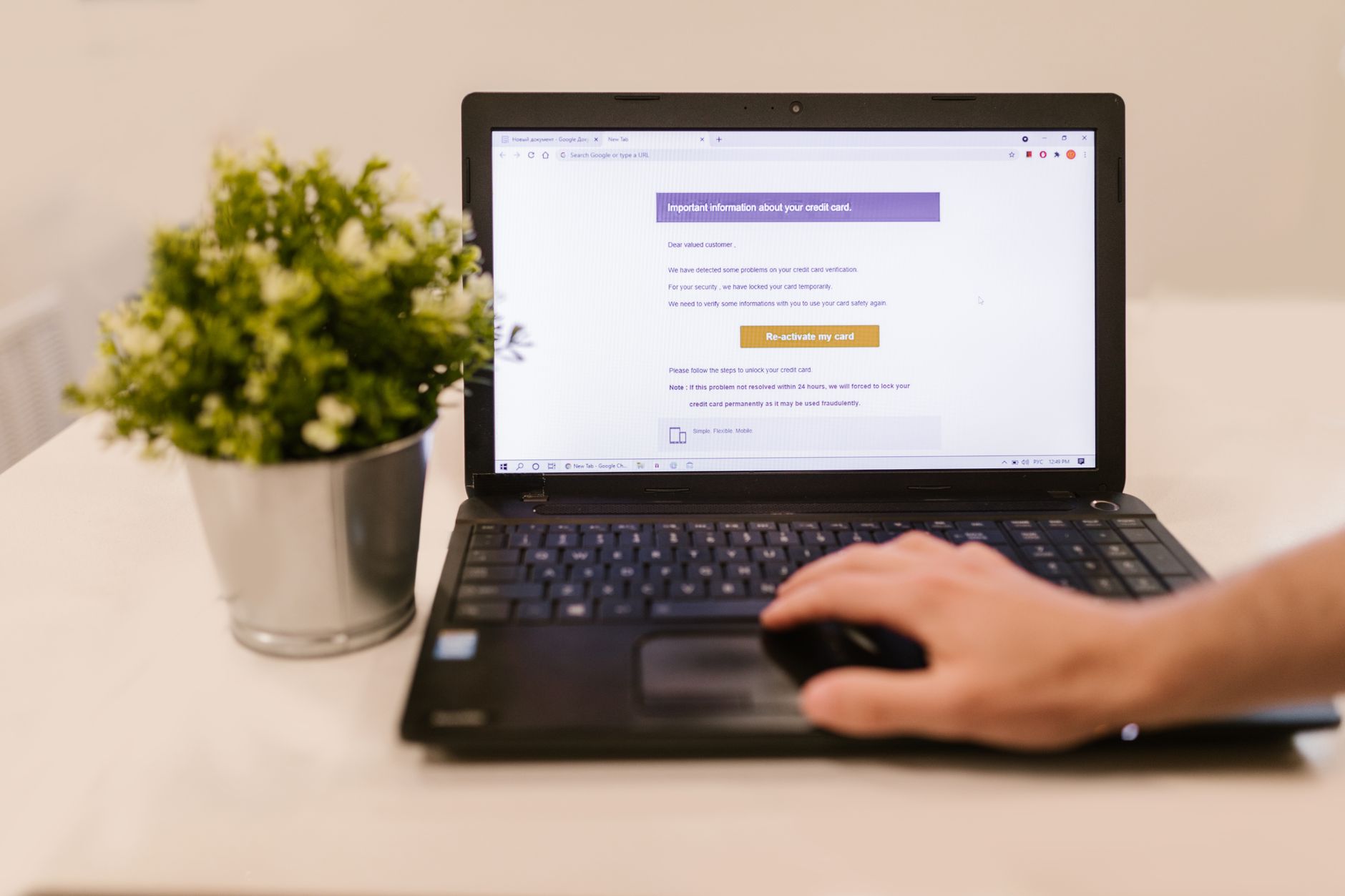 corporate credit cards on a laptop keyboard with an expense dashboard visible on screen