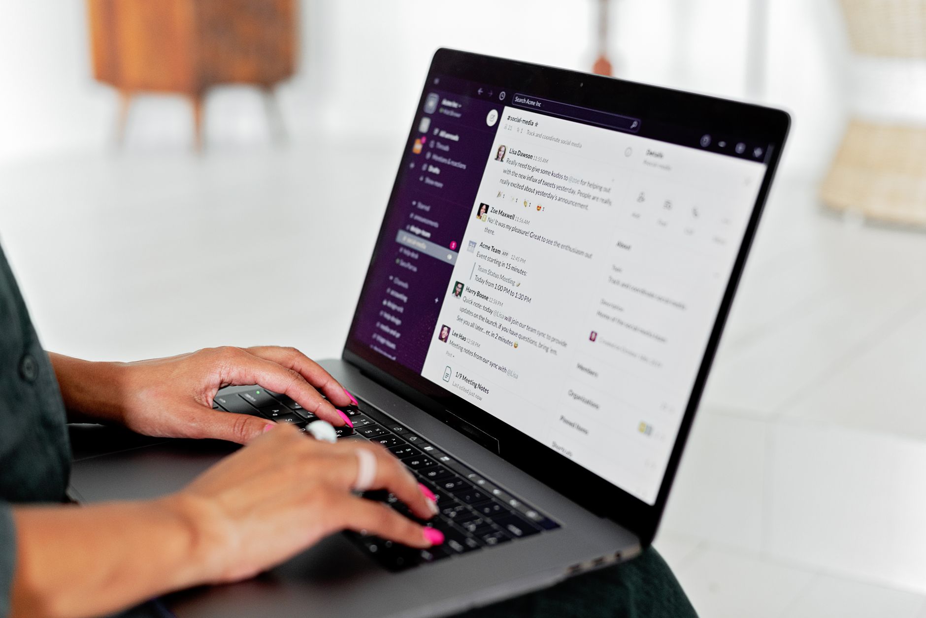Person typing on a laptop displaying a clean AI chat interface