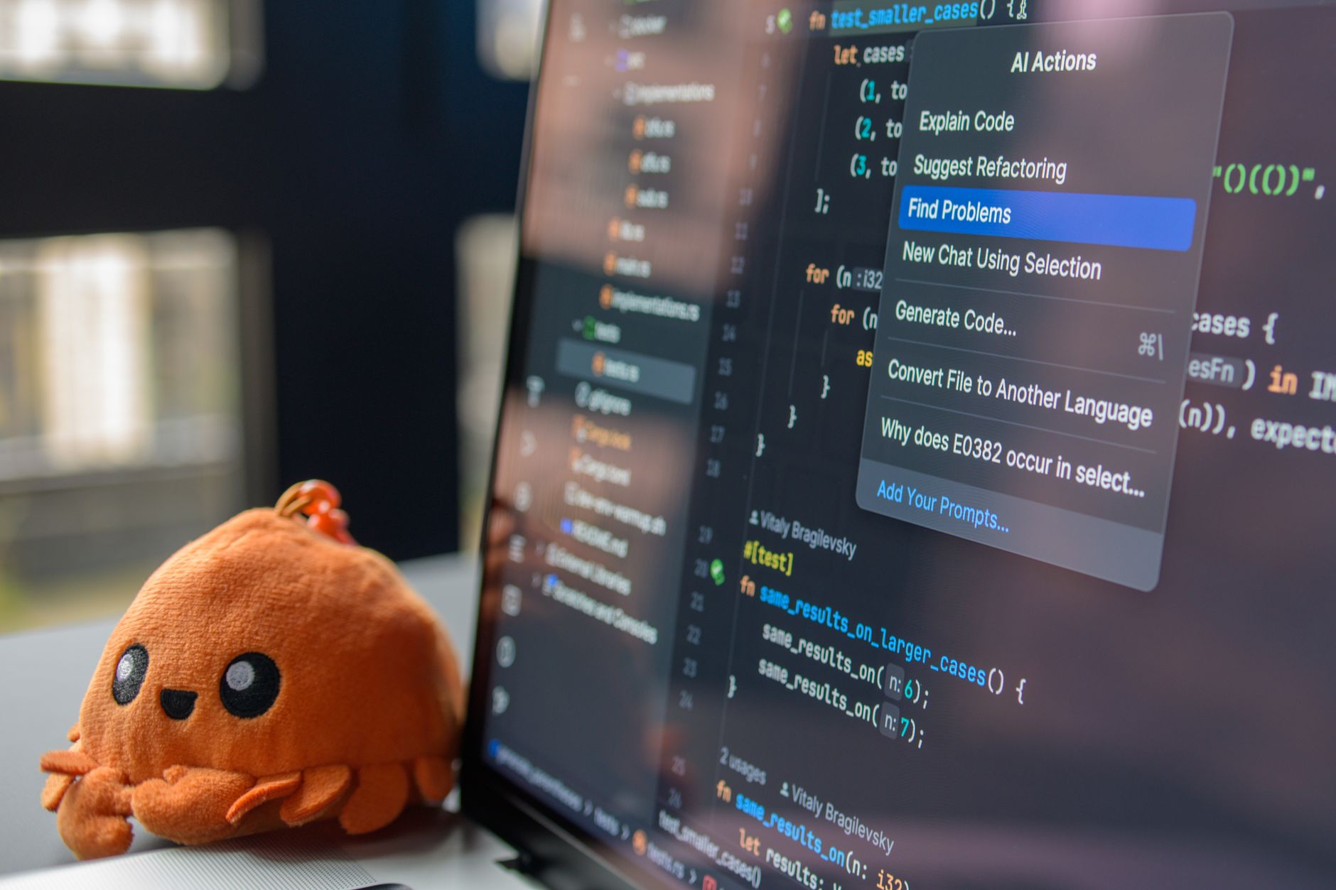 a programmer refactoring legacy code on a computer with multiple code files open