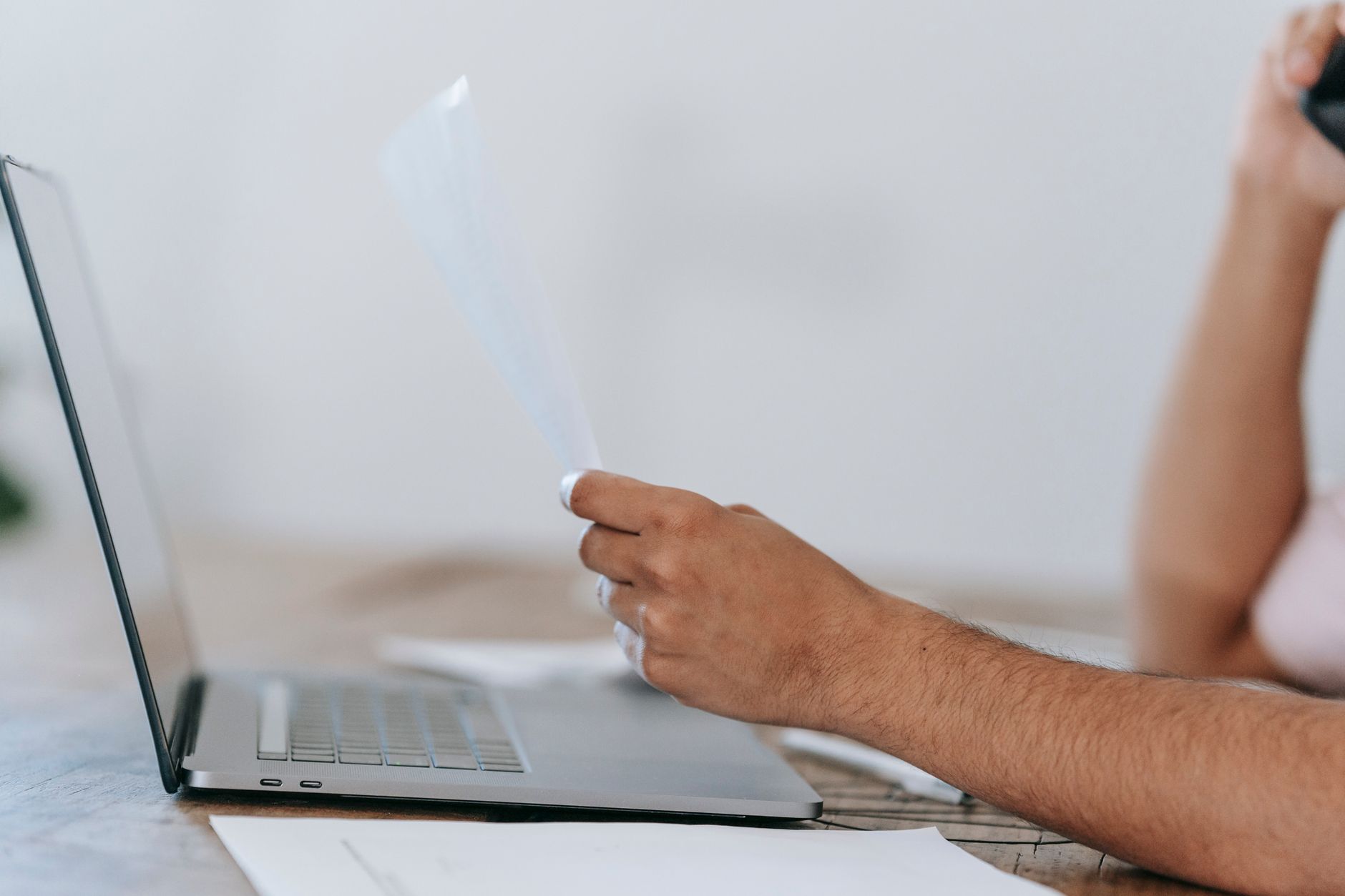 Person sitting at desk reviewing AI job matches on a laptop screen
